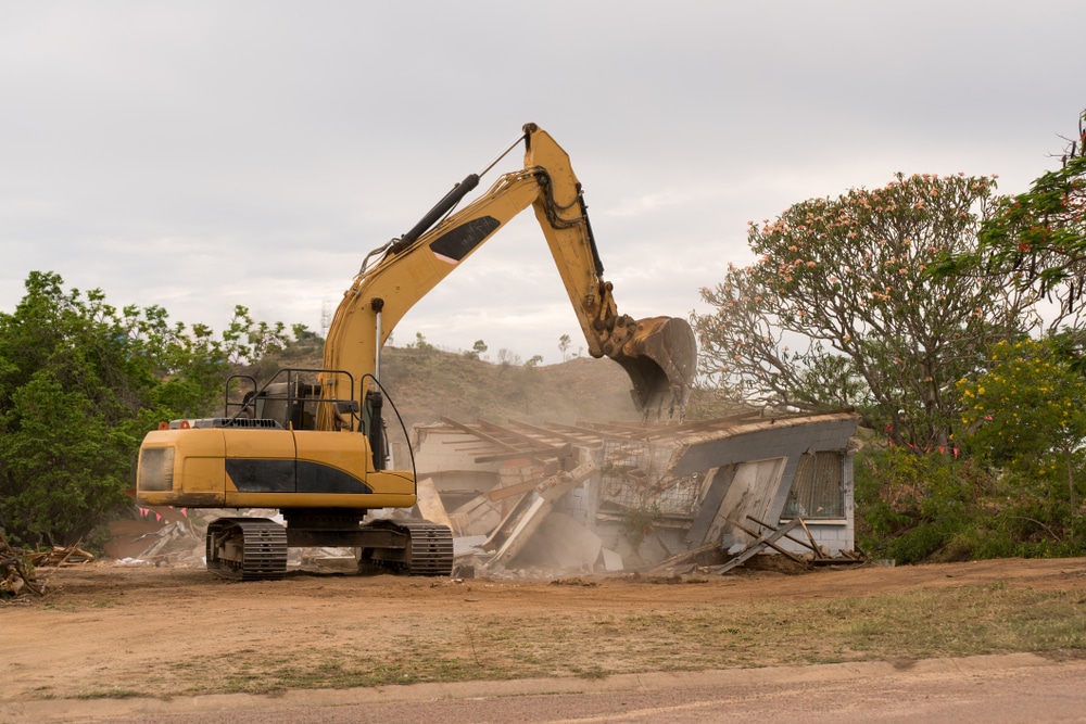 Bulldozer Knocking Down Old House To Rebuild